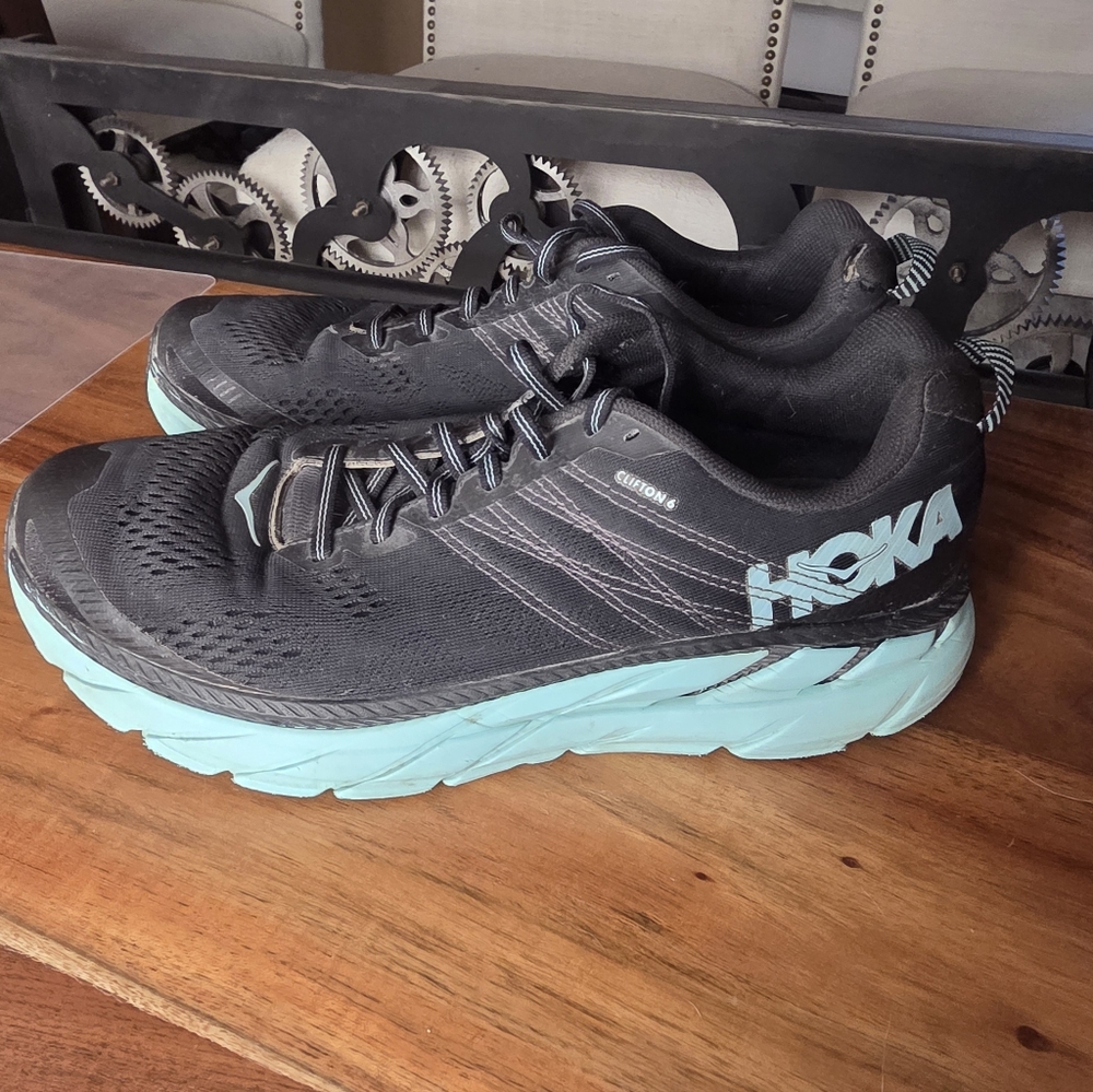 Women's Hoka One One Clifton 4 running shoes in black and aqua.  10.5